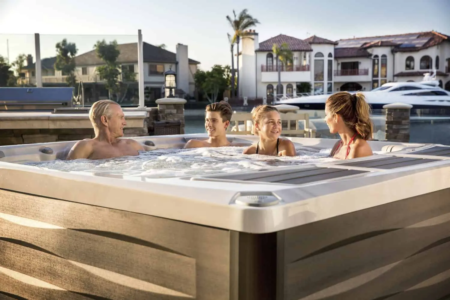 Family Enjoys Time In Their Sundance Spa Hot Tub