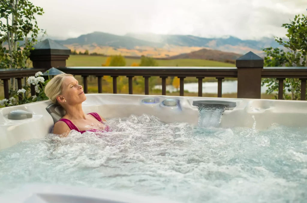 Lady relaxing in Sundance Spas Hot Tub