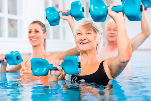 women doing exercise in pool