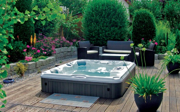 backyard hot tub privacy ideas - hot tub surrounded by plants